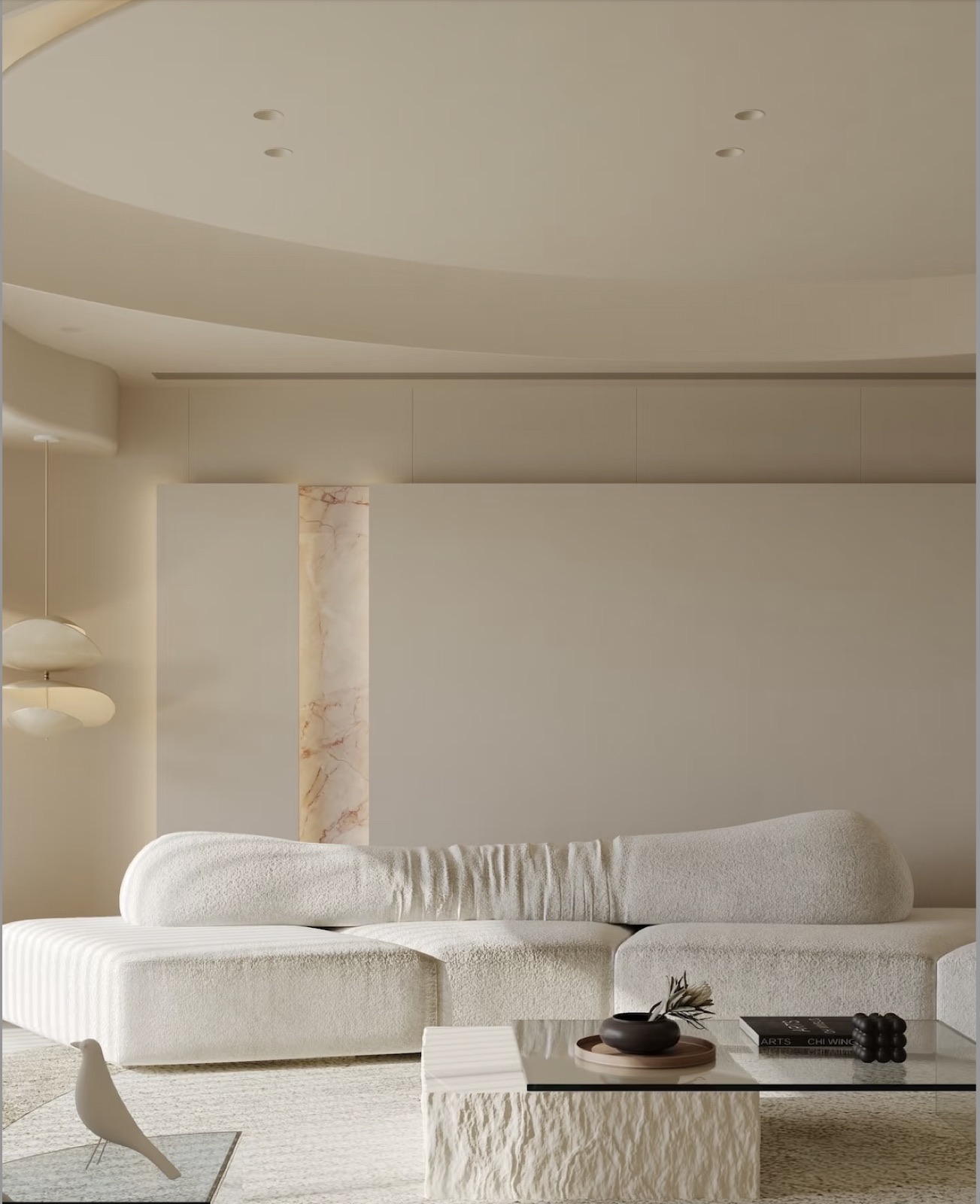 salon crème, sofa modulaire bouclé et colonne travertin — projet résidentiel ayyur interiors.